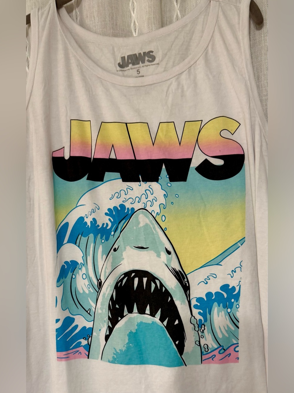 Jaw’s sleeveless tank. Size 5 per label.